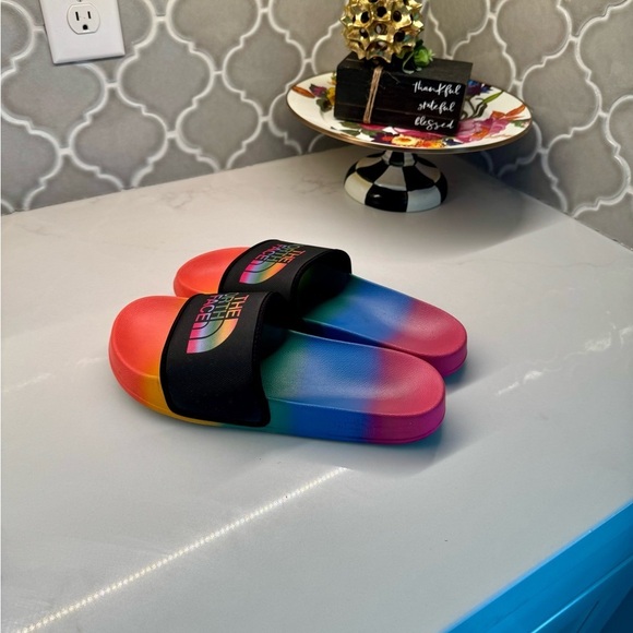 The North Face pride rainbow slides